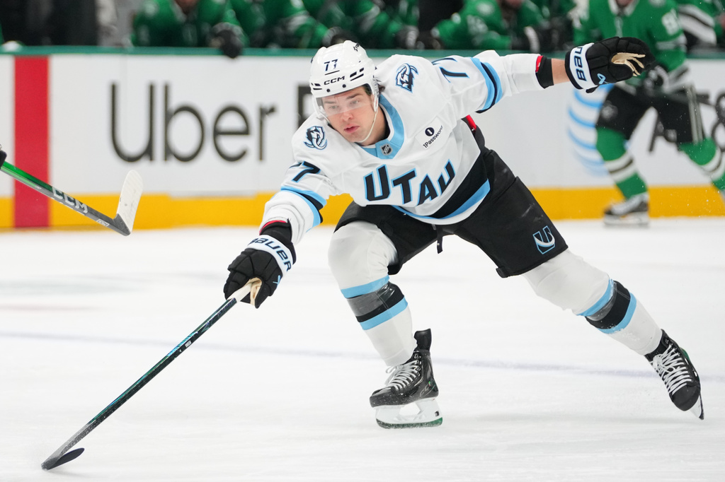 FILE - Utah Mammoth right wing JJ Peterka challenges for the puck during a hockey game, March 16, 2026, in Dallas. (AP Photo/Julio Cortez, File)