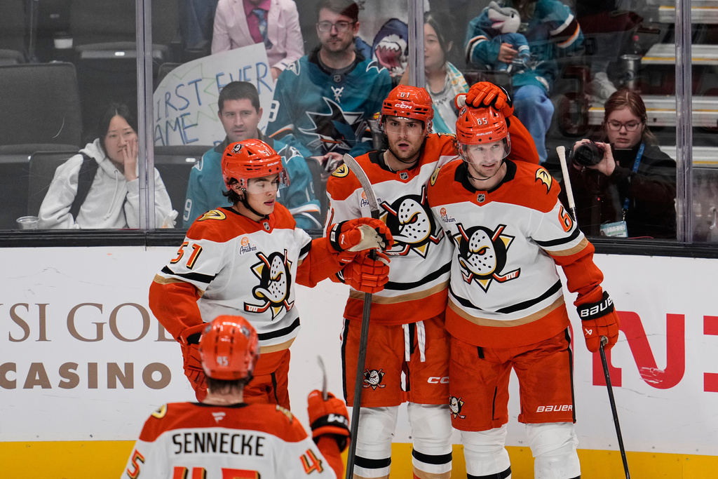 Anaheim Ducks left wing Cutter Gauthier (61) celebrates with teammates after scoring a goal during the third period of an NHL hockey game against the San Jose Sharks, Saturday, Oct. 11, 2025, in San Jose, Calif. (AP Photo/Godofredo A. Vásquez)