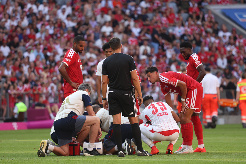 Munich's Jamal Musiala receives medical treatment during a pre-season soccer match between FC Bayern Munich and RB Leipzig in Munich, Germany, Saturday, Aug. 15, 2026. (Karl-Josef Hildenbrand/dpa via AP)