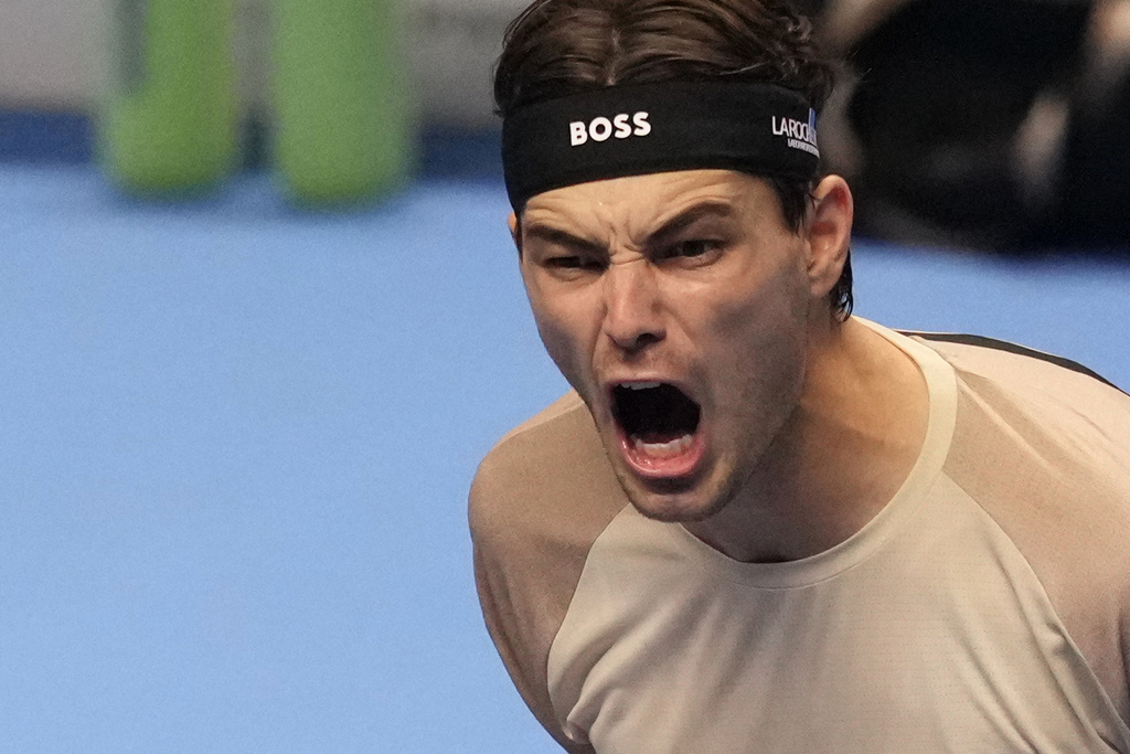 United States' Taylor Fritz celebrates after winning against Italy's Lorenzo Musetti during their singles tennis match of the ATP World Tour Finals, in Turin, Italy, Monday, Nov. 10, 2025. (AP Photo/Antonio Calanni)