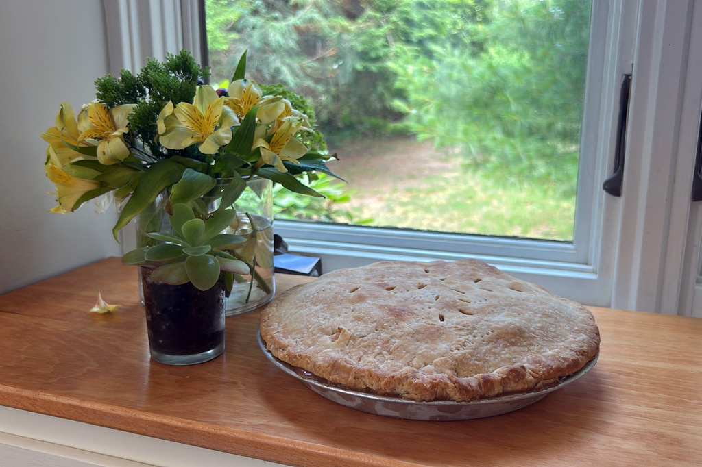 A freshly baked apple pie sits next to a window in Marlborough, Massachusetts on June 26, 2026.(AP Photo/Bev Biller)