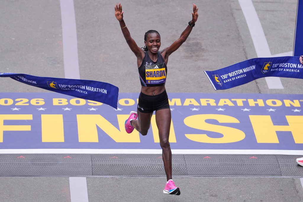 Sharon Lokedi of Kenya, celebrates after winning the women's division of the Boston Marathon, Monday, April 20, 2026, in Boston. (AP Photo/Charles Krupa)