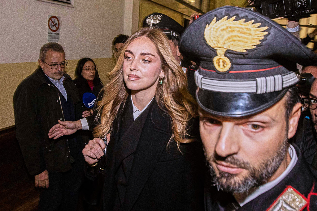 Influencer Chiara Ferragni arrives at the Milan Law Court on Wednesday, Jan. 14, 2026, where a first-instance verdict is expected in a trial in which she was indicted for promoting misleading advertising presented as charity. (Marco Ottico/LaPresse via AP)