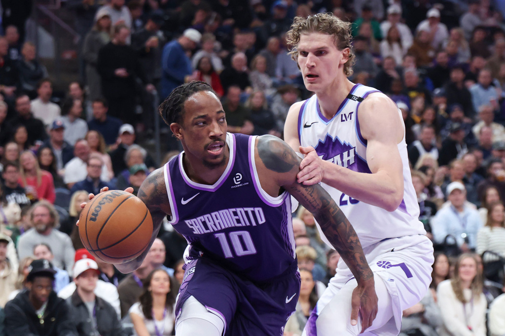 Sacramento Kings guard DeMar DeRozan (10) drives to the basket against Utah Jazz forward Lauri Markkanen, right, during the first half of an NBA basketball game, Wednesday, Feb. 11, 2026, in Salt Lake City. (AP Photo/Rob Gray)