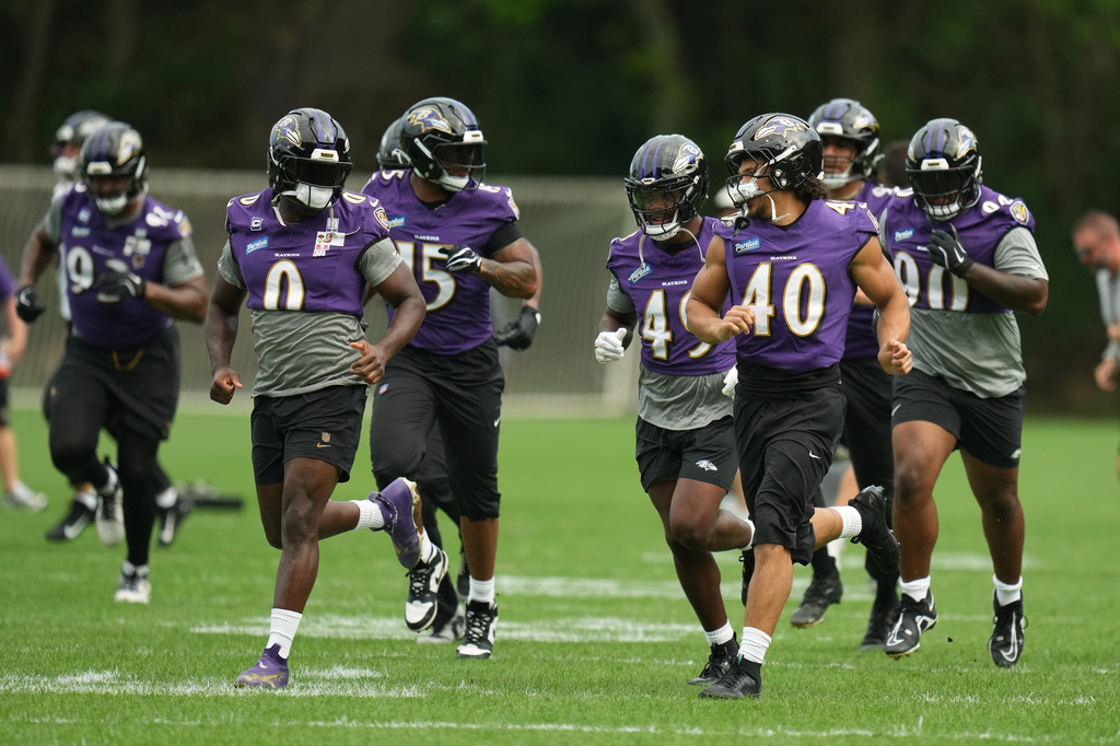 Baltimore Ravens players work out during a practice for an NFL football game against the Dallas Cowboys in Rio de Janeiro, Friday, Sept. 25, 2026. (AP Photo/Andre Penner)
