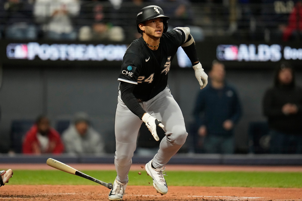 Chicago White Sox's Braden Montgomery (24) watches his 2-run double during the sixth inning of Game 2 of baseball's American League Division Series against the Cleveland Guardians, Monday, Oct. 5, 2026, in Cleveland. (AP Photo/Sue Ogrocki)