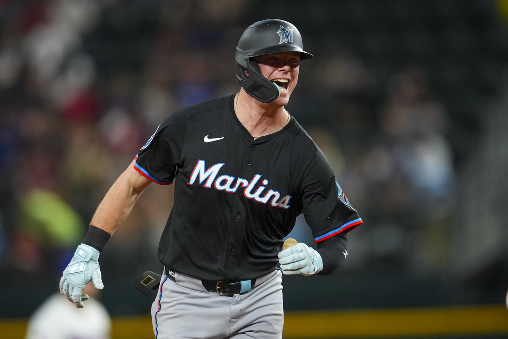 Miami Marlins' Troy Johnston reacts after hitting a solo home run against the Texas Rangers during the sixth inning of a baseball game Saturday, Sept. 20, 2025, in Arlington, Texas. (AP Photo/Julio Cortez)