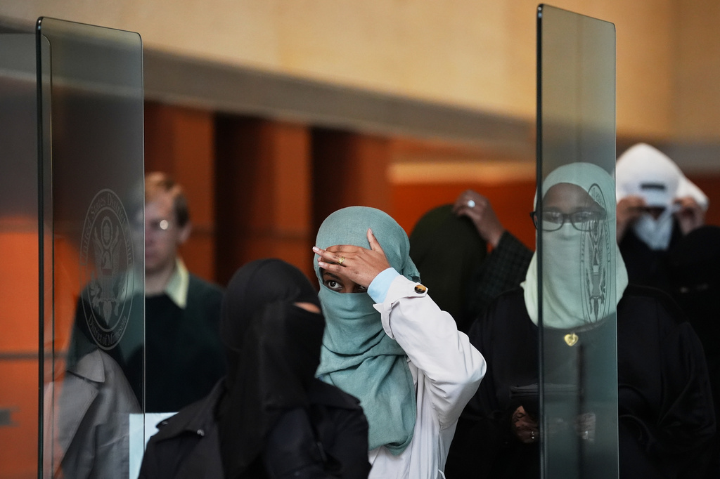 Supporters of Salim Said, who was found guilty in the Feeding Our Future fraud scheme, leave after Said's sentencing hearing, Wednesday, Oct. 28, 2026, in Minneapolis. (AP Photo/Ellen Schmidt)