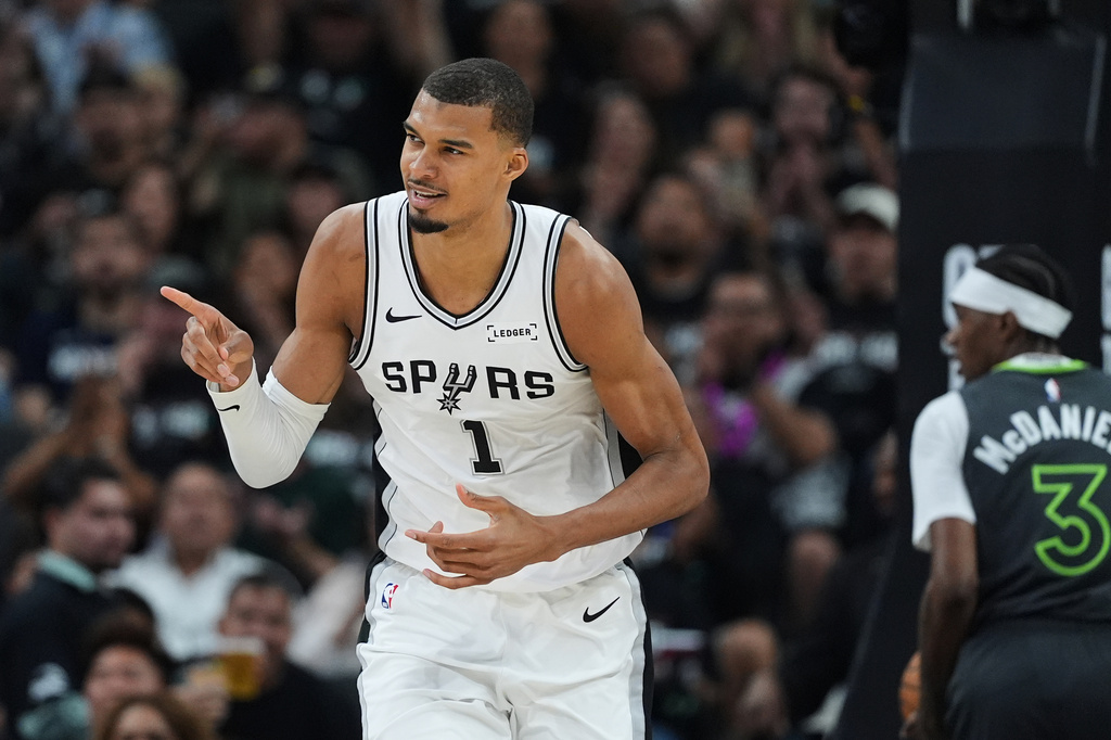 San Antonio Spurs forward Victor Wembanyama (1) reacts to a play during the first half in Game 2 of a second-round NBA playoffs basketball series against the Minnesota Timberwolves in San Antonio, Wednesday, May 6, 2026. (AP Photo/Eric Gay)