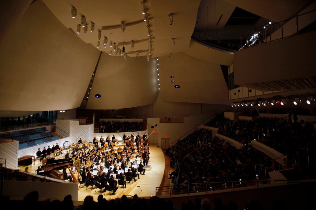 FILE - The New World Symphony performs under the direction of Michael Tilson Thomas, during the grand opening ceremony of the New World Center, a facility designed by architect Frank Gehry, Tuesday, Jan. 25, 2011, in Miami Beach, Fla. (AP Photo/Lynne Sladky, File)