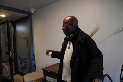 Resident Alex Mannings, who said he was awakened by federal agents during a Sept. 30 raid of the building at 7500 South Shore Drive in Chicago, speaks on Oct. 10, 2025. He described how, "they put me in zip ties, ran my social security number federally, saw that I didn't have any warrants, and let me go." (AP Photo/Erin Hooley) Resident Alex Mannings, who said he was awakened by federal agents during a Sept. 30 raid of the building at 7500 South Shore Drive in Chicago, speaks on Oct. 10, 2025. He described how, "they put me in zip ties, ran my social security number federally, saw that I didn't have any warrants, and let me go." (AP Photo/Erin Hooley)