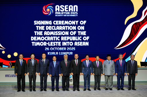 From left, Laos' Prime Minister Sonexay Siphandone, Singapore's Prime Minister Lawrence Wong, Thailand's Prime Minister Anutin Charnvirakul, Vietnam's Prime Minister Pham Minh Chinh, East Timor's Prime Minister Kay Rala Xanana Gusmao, Malaysia's Prime Minister Anwar Ibrahim, Philippines' President Ferdinand Marcos Jr., Brunei's King Sultan Hassanal Bolkiah, Indonesian President Prabowo Subianto, Cambodian Prime Minister Hun Manet and Myanmar's Permanent Secretary of the Ministry of Foreign Affairs U Hau Khan Sum pose for a photo during the signing ceremony of the Declaration on the Admission of East Timor into ASEAN during the 47th ASEAN summit, in Kuala Lumpur, Malaysia, Sunday, Oct. 26, 2025. (AP Photo/Vincent Thian) From left, Laos' Prime Minister Sonexay Siphandone, Singapore's Prime Minister Lawrence Wong, Thailand's Prime Minister Anutin Charnvirakul, Vietnam's Prime Minister Pham Minh Chinh, East Timor's Prime Minister Kay Rala Xanana Gusmao, Malaysia's Prime Minister Anwar Ibrahim, Philippines' President Ferdinand Marcos Jr., Brunei's King Sultan Hassanal Bolkiah, Indonesian President Prabowo Subianto, Cambodian Prime Minister Hun Manet and Myanmar's Permanent Secretary of the Ministry of Foreign Affairs U Hau Khan Sum pose for a photo during the signing ceremony of the Declaration on the Admission of East Timor into ASEAN during the 47th ASEAN summit, in Kuala Lumpur, Malaysia, Sunday, Oct. 26, 2025. (AP Photo/Vincent Thian)