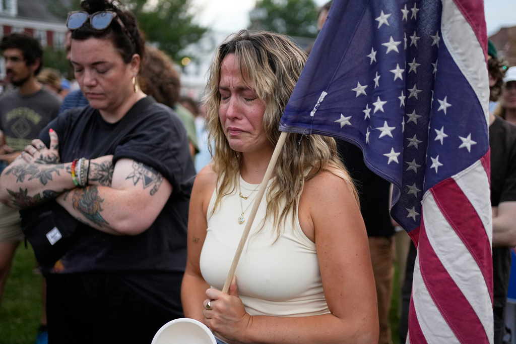 A demonstrator fights back tears at an anti-ICE rally after a man was shot and killed by U.S. Immigration and Customs Enforcement on Monday, July 13, 2026, in Biddeford, Maine. (AP Photo/Robert F. Bukaty)