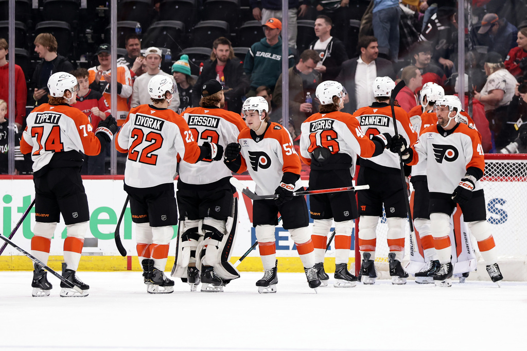 The Philadelphia Flyers celebrate after defeating the New Jersey Devils in an NHL hockey game Tuesday, April 7, 2026, in Newark, N.J. (AP Photo/Adam Hunger)