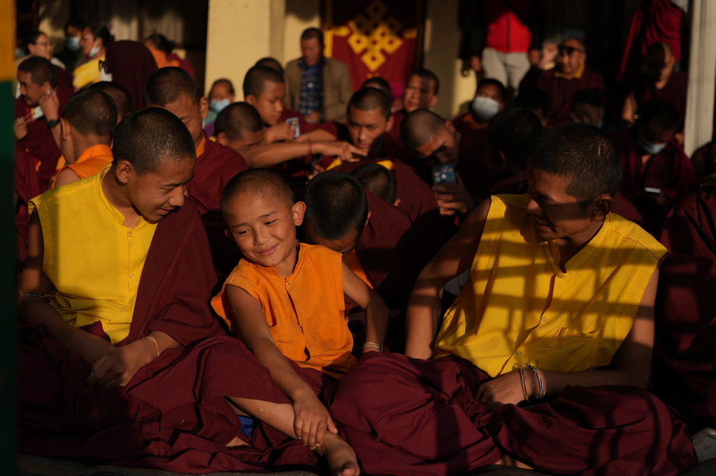 Young monks smile during a break from rituals and teachings at Shechen Monastery in Kathmandu, Nepal, on Thursday, April 9, 2026. (AP Photo/Luis Andres Henao)