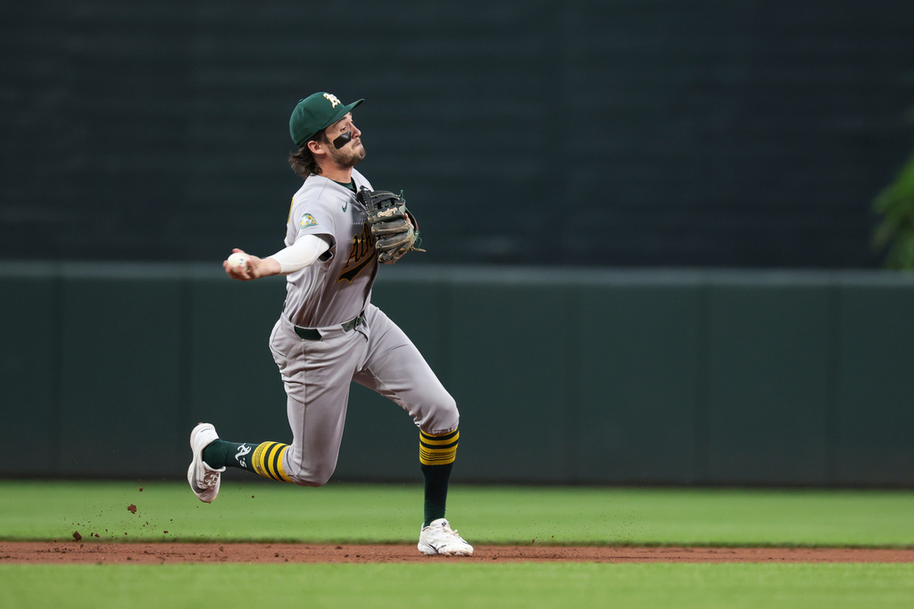 Athletics shortstop Jacob Wilson throws to first base for an out on a ball hit by Baltimore Orioles' Pete Alonso during the first inning of a baseball game, Friday, May 8, 2026, in Baltimore. (AP Photo/Terrance Williams)