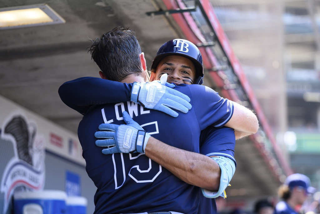 Tampa Bay Rays' Christopher Morel, right, is greeted by Josh Lowe after hitting a home run during the seventh inning of a baseball game against the Los Angeles Angels Wednesday, Aug. 6, 2025, in Anaheim, Calif. (AP Photo/William Liang)