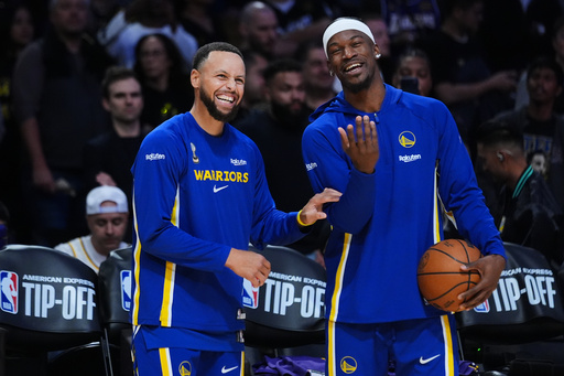 Golden State Warriors guard Stephen Curry, left, smiles next to forward Jimmy Butler III before an NBA basketball game against the Los Angeles Lakers Tuesday, Oct. 21, 2025, in Los Angeles. (AP Photo/Ethan Swope) Golden State Warriors guard Stephen Curry, left, smiles next to forward Jimmy Butler III before an NBA basketball game against the Los Angeles Lakers Tuesday, Oct. 21, 2025, in Los Angeles. (AP Photo/Ethan Swope)