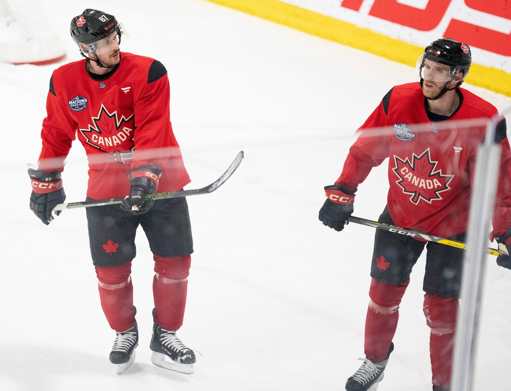 FILE - Canada's Sidney Crosby and Connor McDavid skate together following 4 Nations Face-Off hockey practice in Brossard, Quebec on Monday, Feb. 10, 2025. Canada will face Sweden on February 12. (Christinne Muschi/The Canadian Press via AP, File)