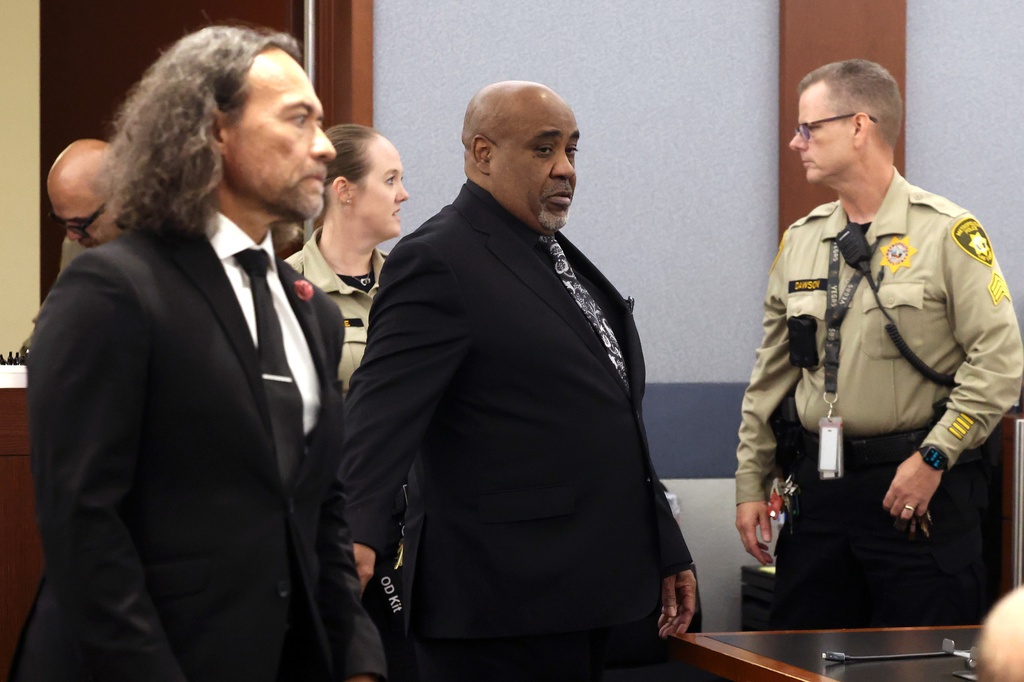 Duane Davis, center, and his attorney Michael Sanft are led back to a courtroom to hear his sentencing date after a jury found Davis guilty of first-degree murder in his trial related to the 1996 killing of rapper Tupac Shakur, at Clark County District Court Regional Justice Center, Monday, Aug. 31, 2026, in Las Vegas. (Bizuayehu Tesfaye/Las Vegas Review-Journal via AP, Pool)