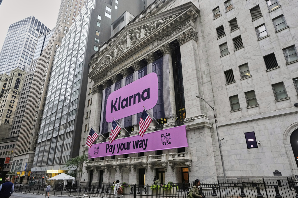 The facade of New York Stock Exchange displays signage for Sweden's Klarna, Wednesday, Sept. 10, 2025. (AP Photo/Richard Drew)
