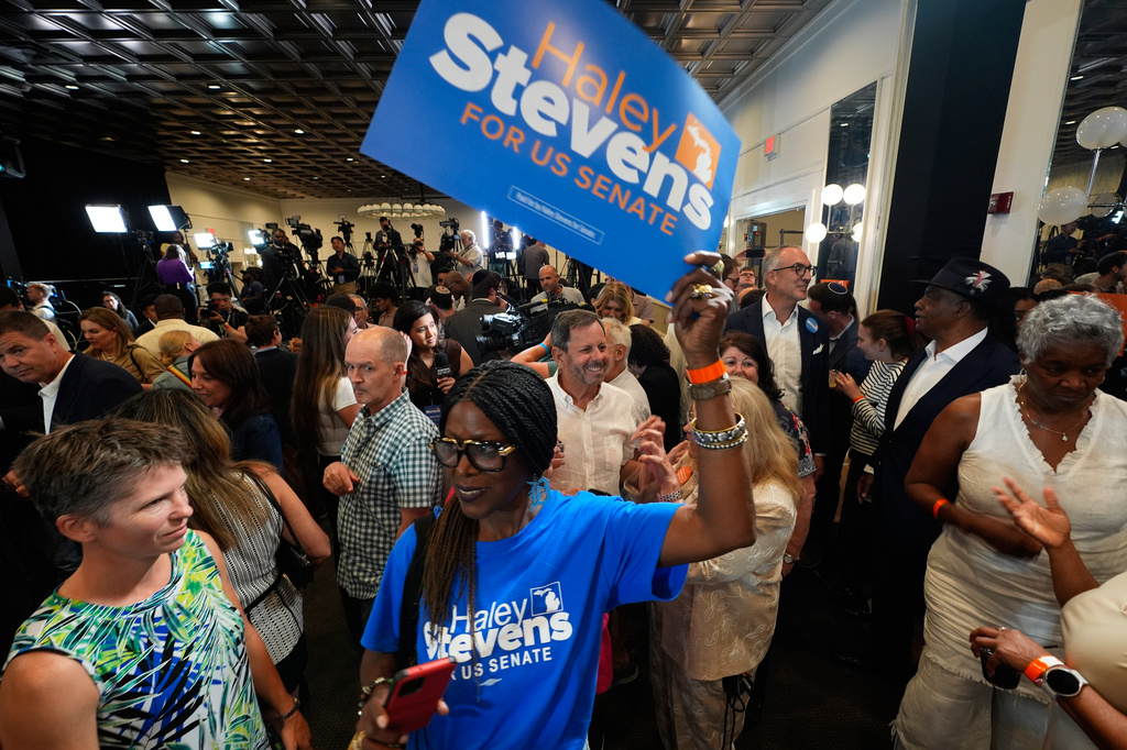 An attendee holds a sign for Rep. Haley Stevens, D-Mich., a candidate in the Democratic primary for U.S. Senate in Michigan, during a primary election night event Tuesday, Aug. 4, 2026, in Detroit. (AP Photo/Paul Sancya)