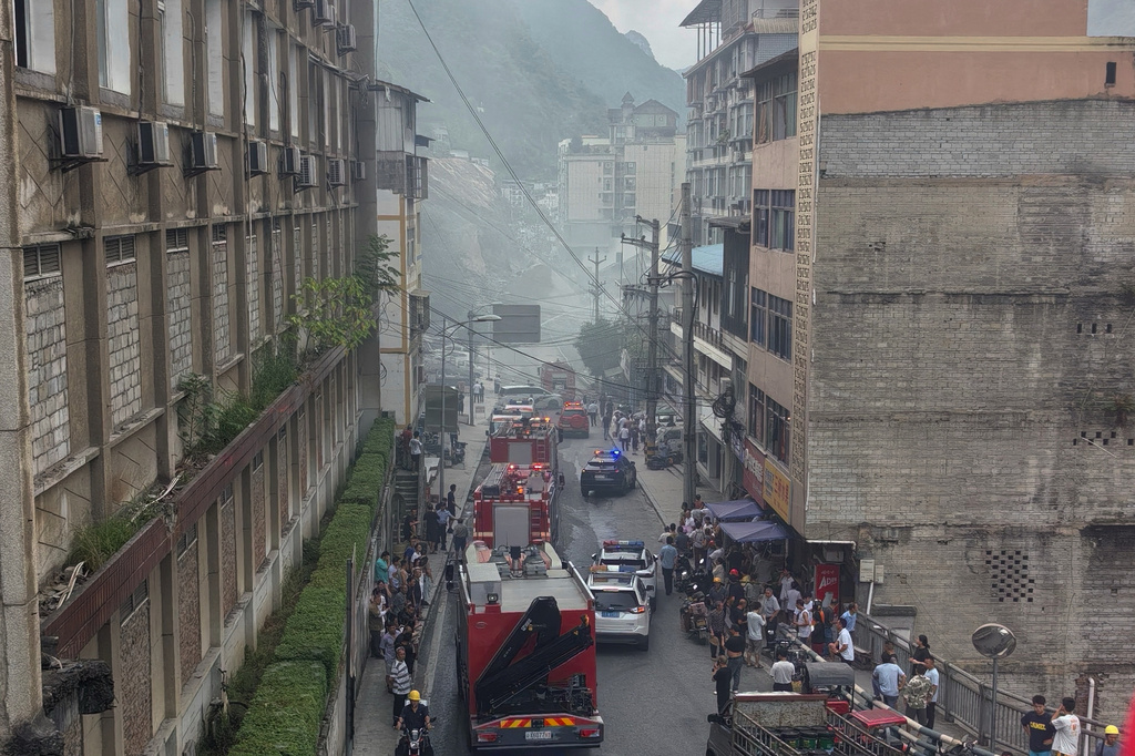 This photo taken and provided by Mimama shows firefighters arrive to the landslide scene in Pengshui County in southwestern China's Chongqing on Friday, July 17, 2026. (Mimama via AP)