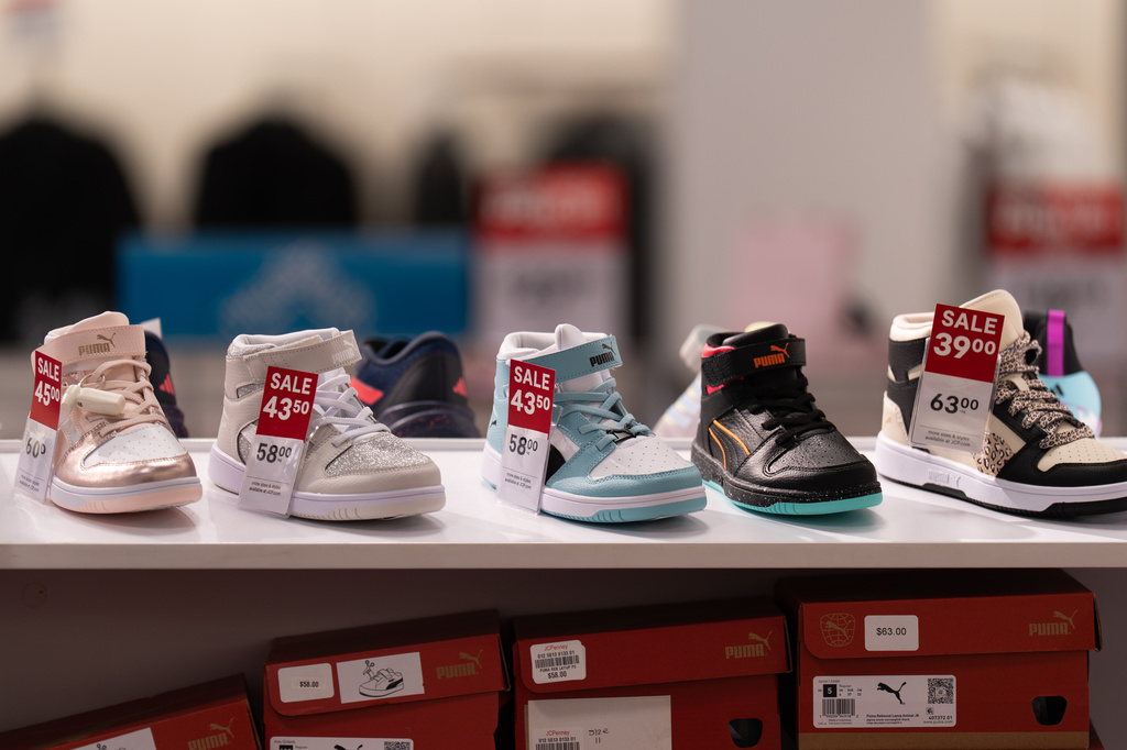Children's shoes for sale are displayed at a JCPenney store in Glendale, Calif., Tuesday, Aug. 11, 2026. (AP Photo/Jae C. Hong)