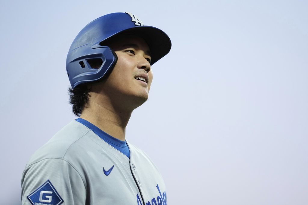 Los Angeles Dodgers' Shohei Ohtani walks to the dugout after being called out on strikes during the fourth inning of a baseball game against the San Francisco Giants, Saturday, Sept. 13, 2025, in San Francisco. (AP Photo/Godofredo A. Vásquez)