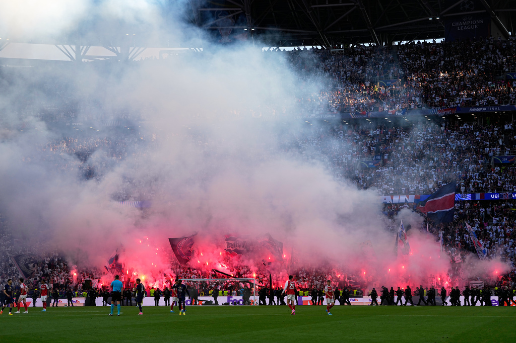 PSG fans celebrate their side's first goal during the Champions League final soccer match between Paris Saint-Germain and Arsenal in Budapest, Hungary, Saturday, May 30, 2026. (AP Photo/Petr Josek)