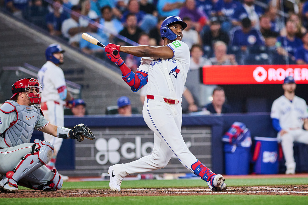Toronto Blue Jays' Jesus Sanchez hits a home run during the sixth inning of a baseball game against the Philadelphia Phillies, in Toronto, on Tuesday, June 9, 2026. (Sammy Kogan/The Canadian Press via AP)