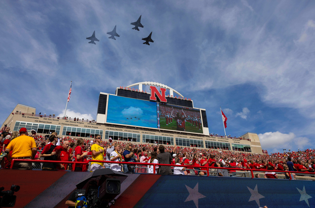 FILE - Four F-16s fly over Memorial Stadium during the playing of the national anthem before an NCAA college football game between Michigan and Nebraska, Saturday, Sept. 20, 2025, in Lincoln, Neb. (AP Photo/Rebecca S. Gratz, File)