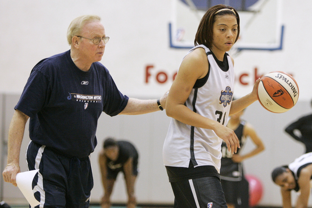 FILE - Washington Mystics head coach Richie Adubato works with Aiysha Smith during and WNBA basketball practice, May 10, 2006, at the Verizon Center in Washington. (AP Photo/Gerald Herbert, File)