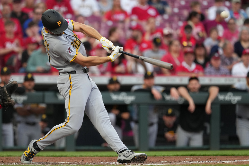 Pittsburgh Pirates' Bryan Reynolds hits a solo home run during the second inning of a baseball game against the Cincinnati Reds, Tuesday, March 31, 2026, in Cincinnati. (AP Photo/Kareem Elgazzar)