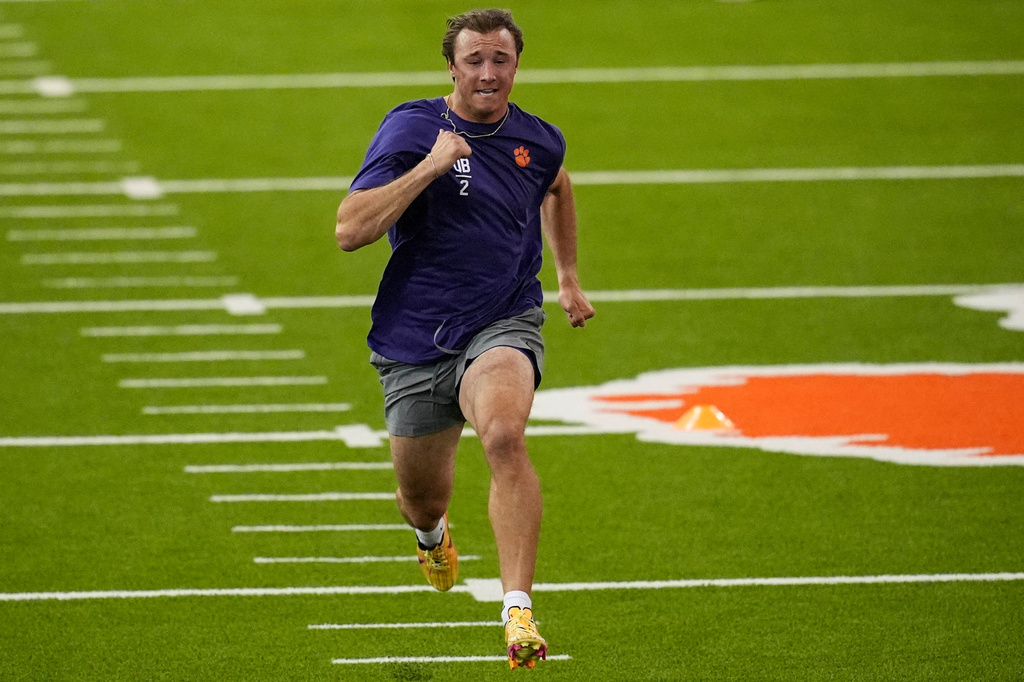 FILE - Clemson quarterback Cade Klubnik runs the 40-yard dash during the school's NFL football pro day, Thursday, March 12, 2026, in Clemson, S.C.. (AP Photo/Mike Stewart, File)