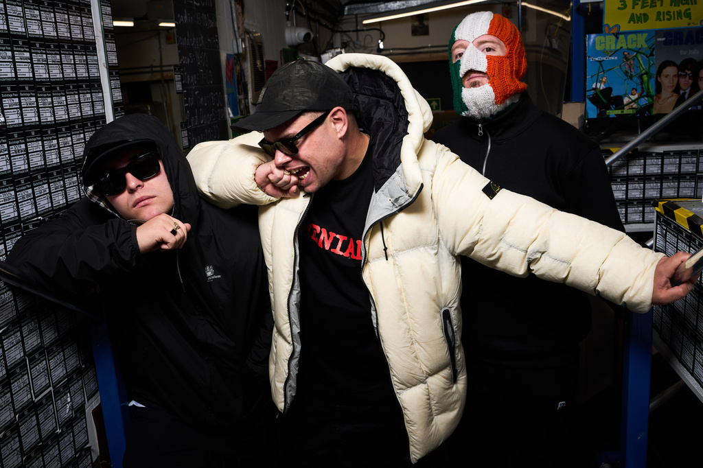 Liam Og O hAnnaidh, aka Mo Chara, from left, Naoise O Caireallain, aka Moglai Bap, J. J. O Dochartaigh, aka DJ Provai, from the band Kneecap pose for portrait photographs on Thursday, April 30, 2026, in London. (Photo by Scott A Garfitt/Invision/AP)
