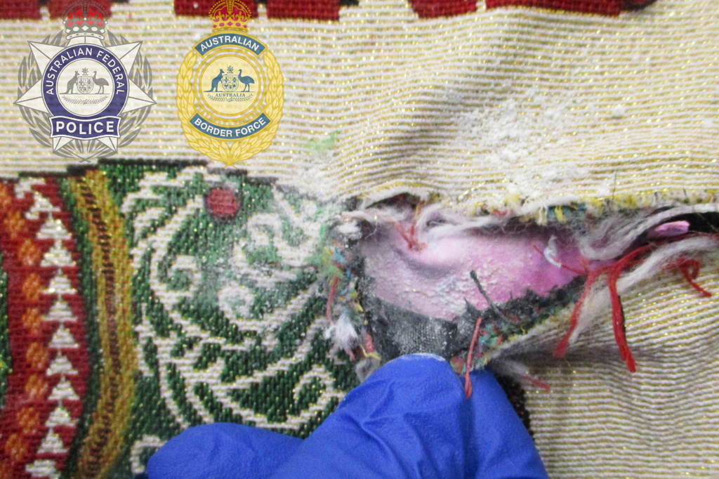 This June 25, 2026, photo released by the Australian Federal Police, Monday, June 29, 2026, shows a tote bag with part of a heroin seizure at Melbourne Airport, Melbourne, Australia. (Australian Federal Police via AP)