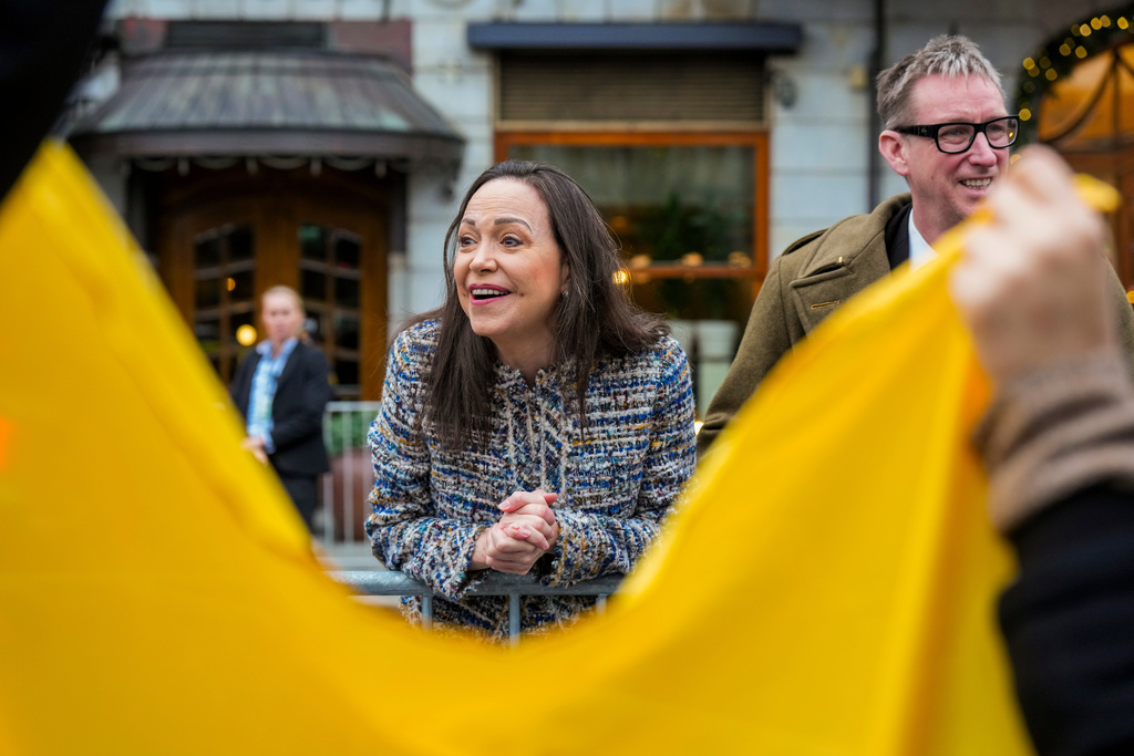 Nobel Peace Prize winner María Corina Machado with Deputy Leader of the Norwegian Nobel Committee Asle Toje, right, outside the Grand Hotel in Oslo, Friday Dec. 12, 2025. (Ole Berg-Rusten/NTB via AP)