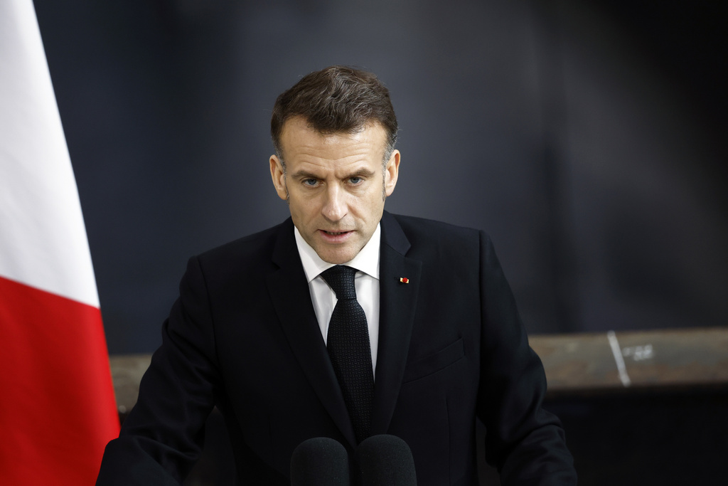 French President Emmanuel Macron delivers a speech next to the submarine 'Le Temeraire' (The Temerarious) at the Nuclear submarines Navy base of Ile Longue in Crozon, France, Monday March 2, 2026. (Yoan Valat/Pool Photo via AP)