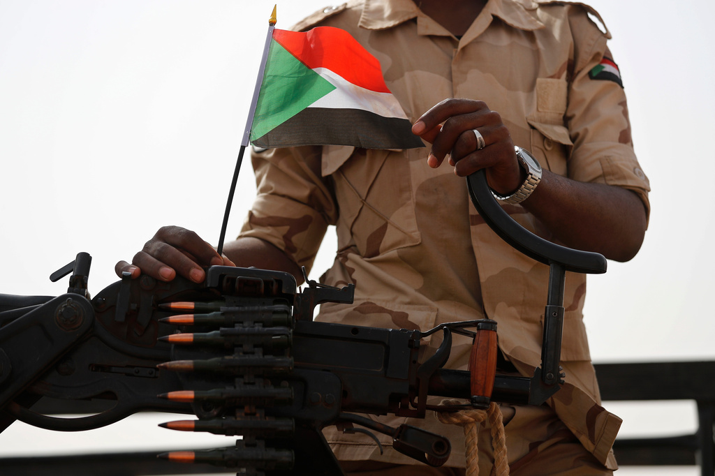 FILE - A Sudanese soldier from the Rapid Support Forces or RSF stands on his vehicle in the East Nile province, Sudan, on June 22, 2019. (AP Photo/Hussein Malla, File)