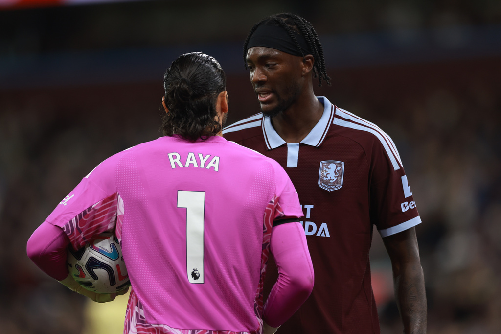 Aston Villa's Tammy Abraham speaks to Arsenal's goalkeeper David Raya during the English Premier League soccer match between Aston Villa and Arsenal in Birmingham, England, Monday, Aug. 31, 2026. (AP Photo/Morgan Harlow)