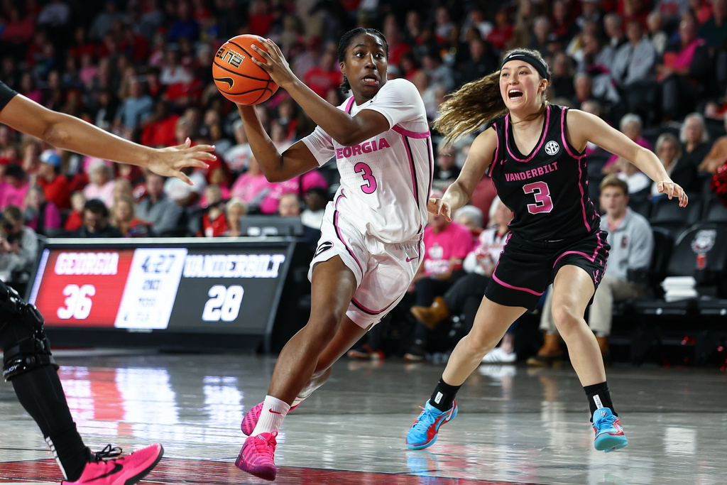 Georgia guard Dani Carnegie (3) dribbles against Vanderbilt guard Aubrey Galvan (3) during the first half of an NCAA college basketball game, Sunday, Feb. 15, 2026, in Athens, Ga. (AP Photo/Colin Hubbard)