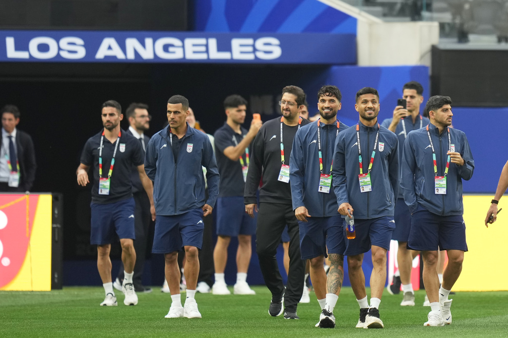 Iran players walk onto the pitch at the stadium one day before their FIFA World Cup match against New Zealand in Inglewood, Calif., near Los Angeles, Sunday, June 14, 2026. (AP Photo/Andre Penner)