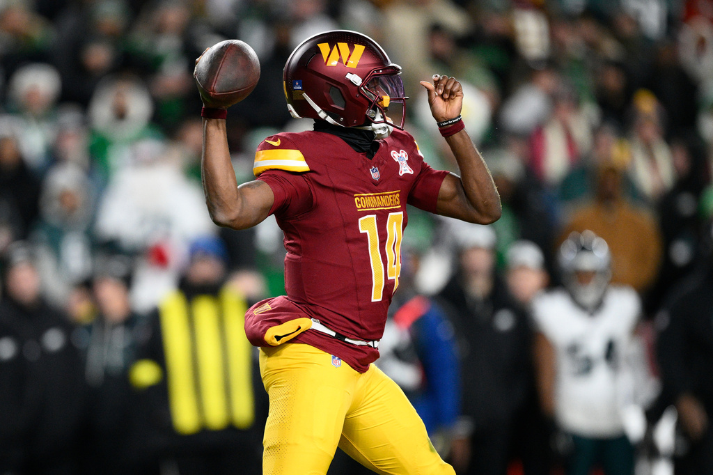 Washington Commanders quarterback Josh Johnson passes against the Philadelphia Eagles during the second half of an NFL football game, Saturday, Dec. 20, 2025, in Landover, Md. (AP Photo/Nick Wass)