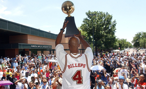 FILE - Denver native Chauncey Billups holds his MVP trophy for fans to see during a ceremony where he was honored in the Park Hill neighborhood of Denver on July 1, 2004. (AP Photo/Ed Andrieski, file) FILE - Denver native Chauncey Billups holds his MVP trophy for fans to see during a ceremony where he was honored in the Park Hill neighborhood of Denver on July 1, 2004. (AP Photo/Ed Andrieski, file)