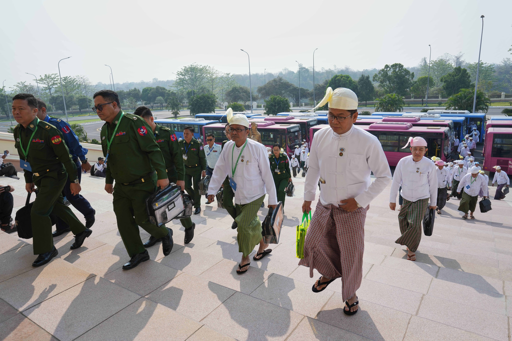 Myanmar's military representatives and lawmakers arrive to attend a session at Union parliament in Naypyitaw, Myanmar, Friday, April 3, 2026.(AP Photo/Aung Shine Oo)