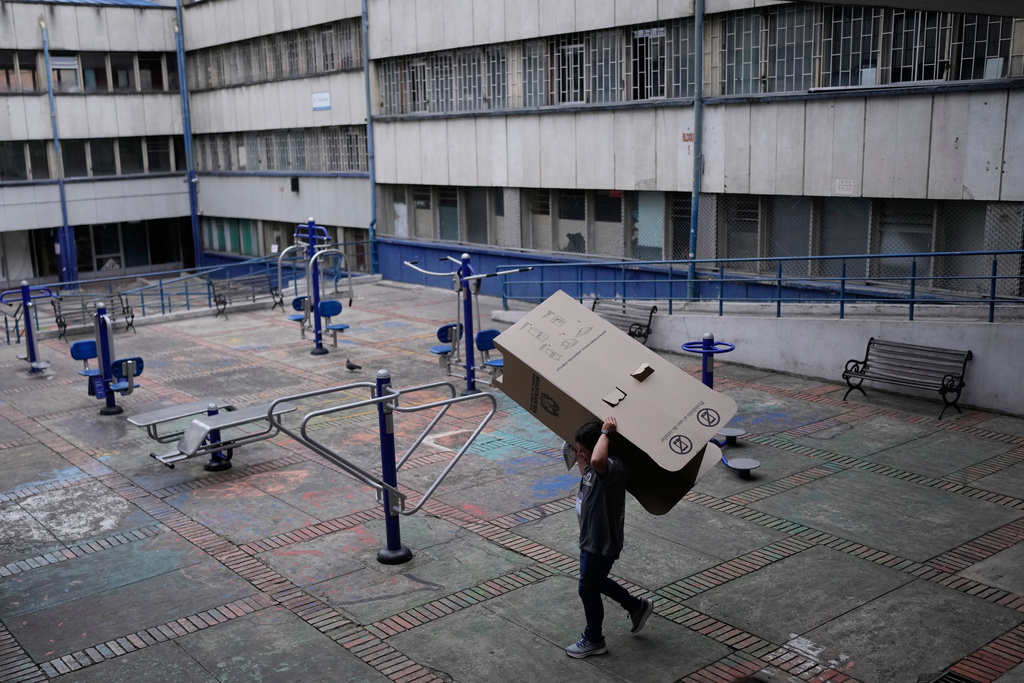 Election workers dismantle electoral booths after polls closed during the presidential election in Bogota, Colombia, Sunday, May 31, 2026.(AP Photo/Matias Delacroix)