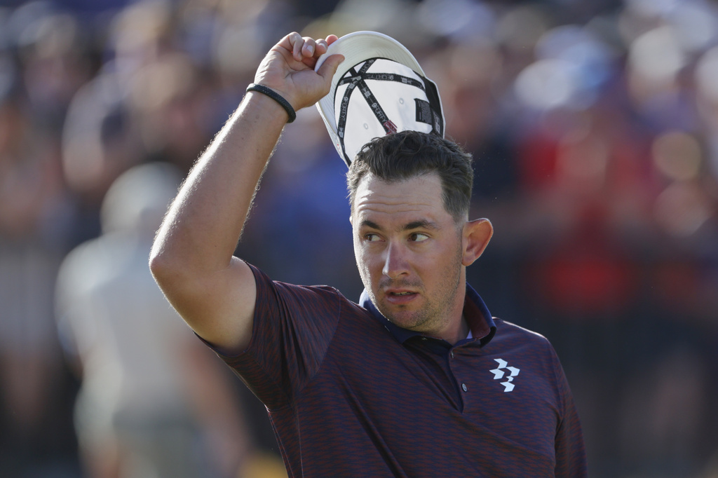 Lucas Herbert of Australia acknowledges the crowd on the 18th green after completing his final round during the final day of the British Open Golf championships at Royal Birkdale golf club, in Southport, England, Sunday, July 19, 2026. (AP Photo/Peter Morrison)