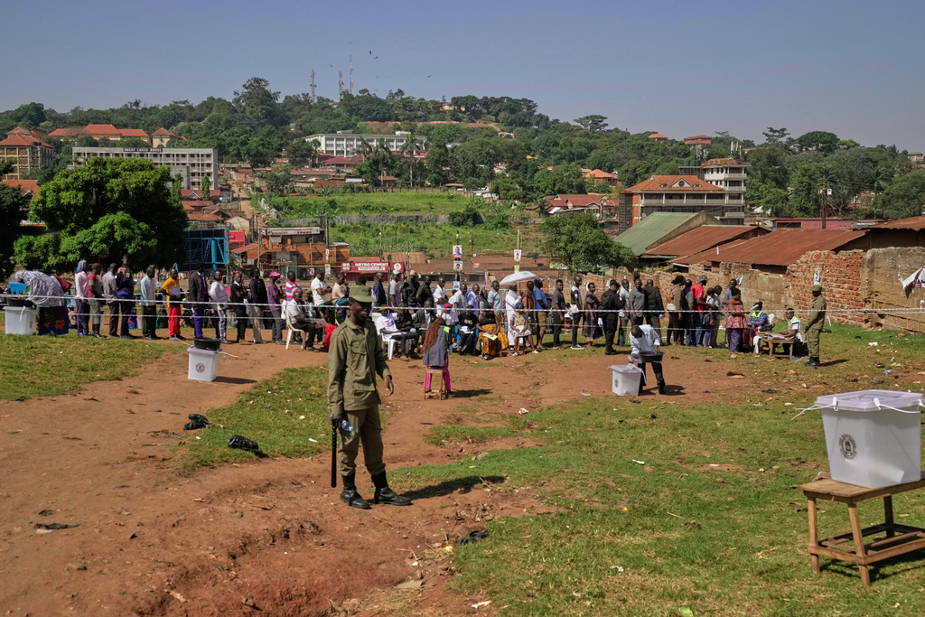 Voters line up to cast their ballots at a polling station, during the presidential election, in the capital, Kampala, Uganda, Thursday, Jan. 15, 2026. (AP Photo/Brian Inganga)