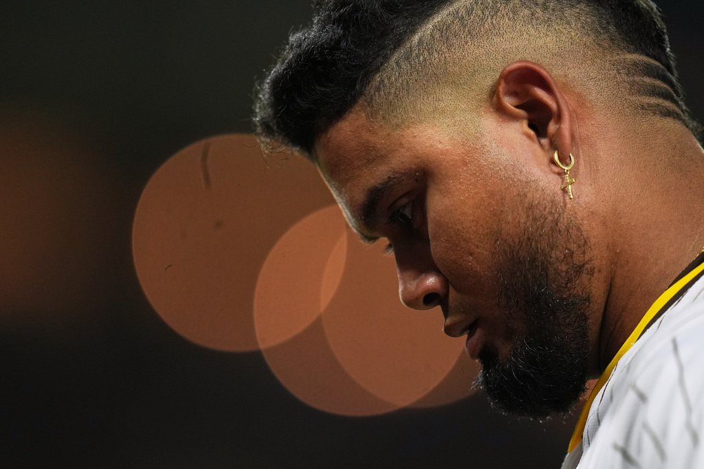 San Diego Padres' Luis Arraez walks back towards the dugout after grounding into a double play during the sixth inning of a baseball game against the Milwaukee Brewers Tuesday, Sept. 23, 2025, in San Diego. (AP Photo/Gregory Bull)